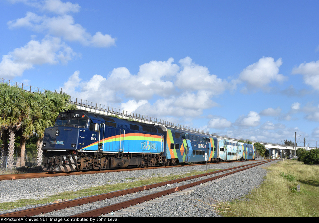 F40PH-3C # 811 pushes Tri-Rail Train # P668 away from the NW 28th Street grade crossing in Miami where I took this photo from